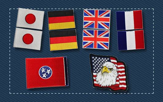 Country state and American flag patches arranged on blue fabric
