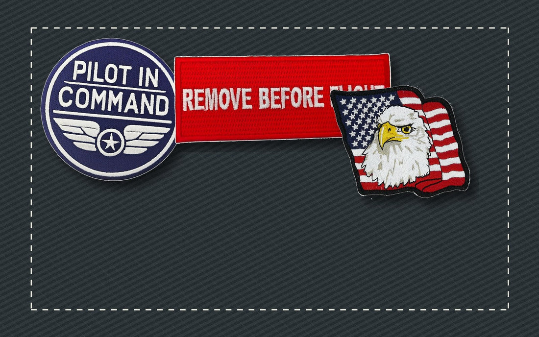 Embroidered aviation, workwear, and flag patches arranged on dark fabric