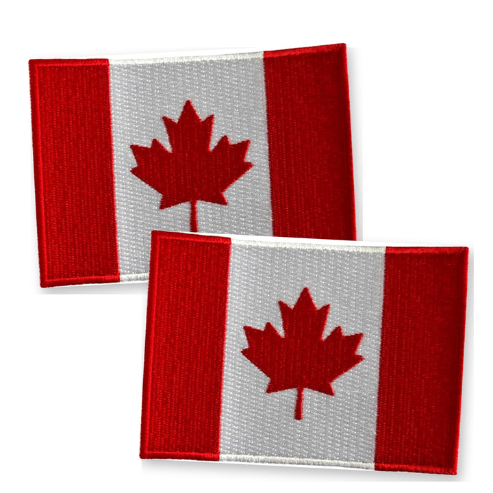 Two embroidered Canada flag iron-on patches with the red maple leaf